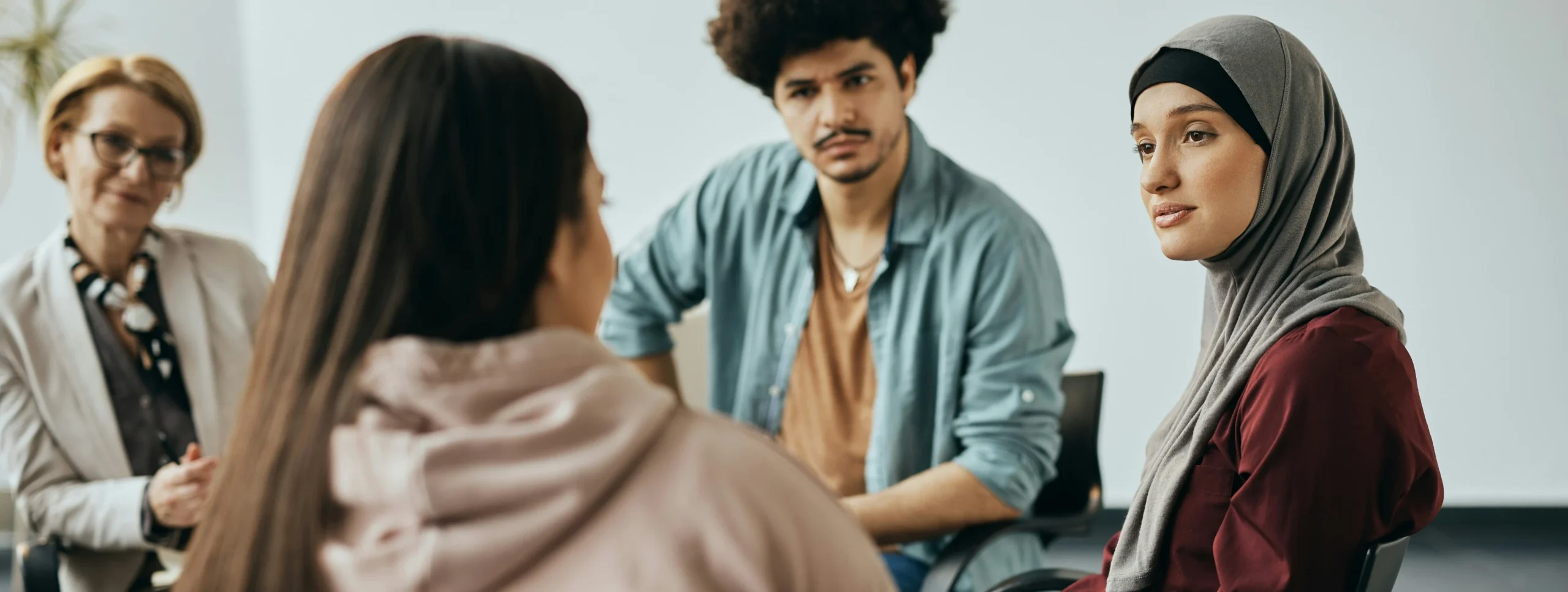group of people talking at table